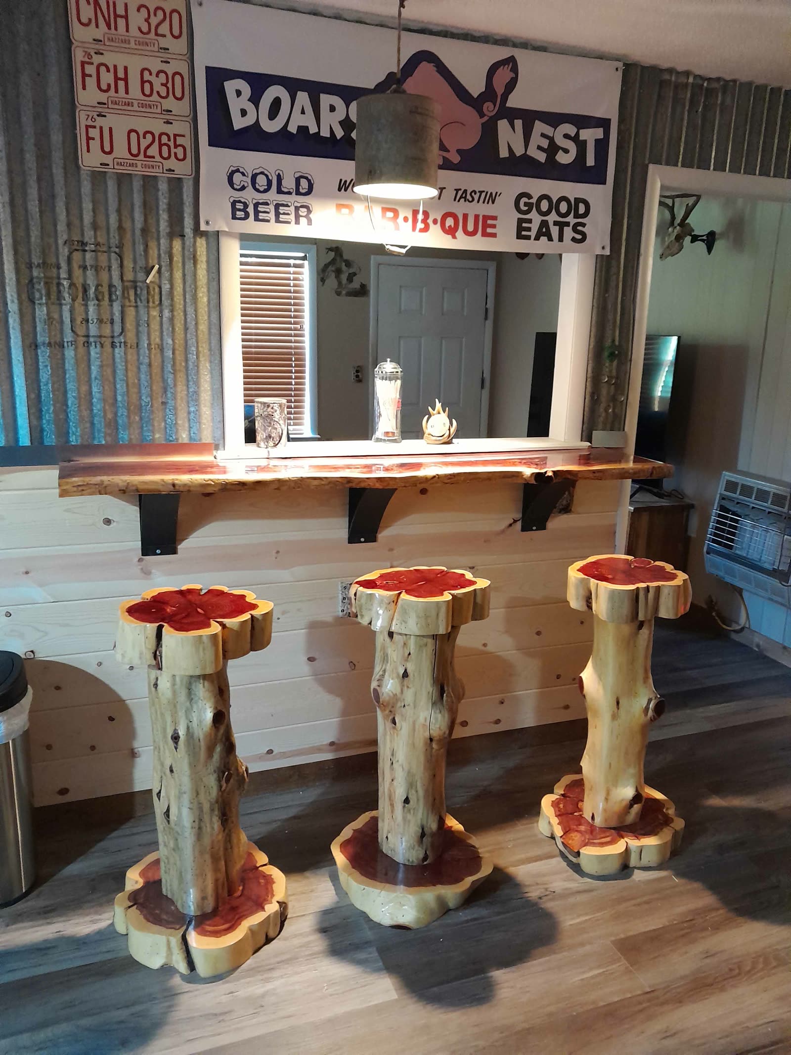 Three live-edge cedar bar stools at a bar