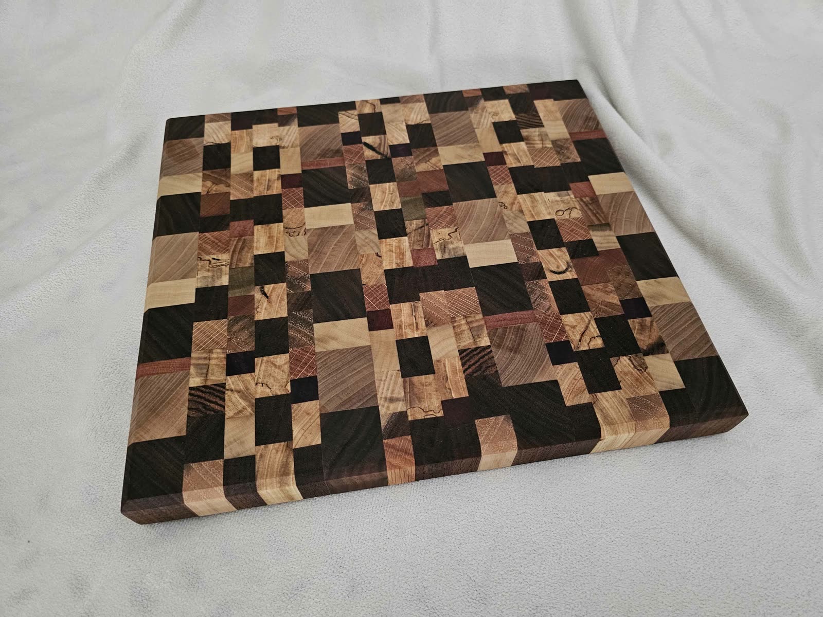 End-grain chaos cutting board in mixed hardwoods