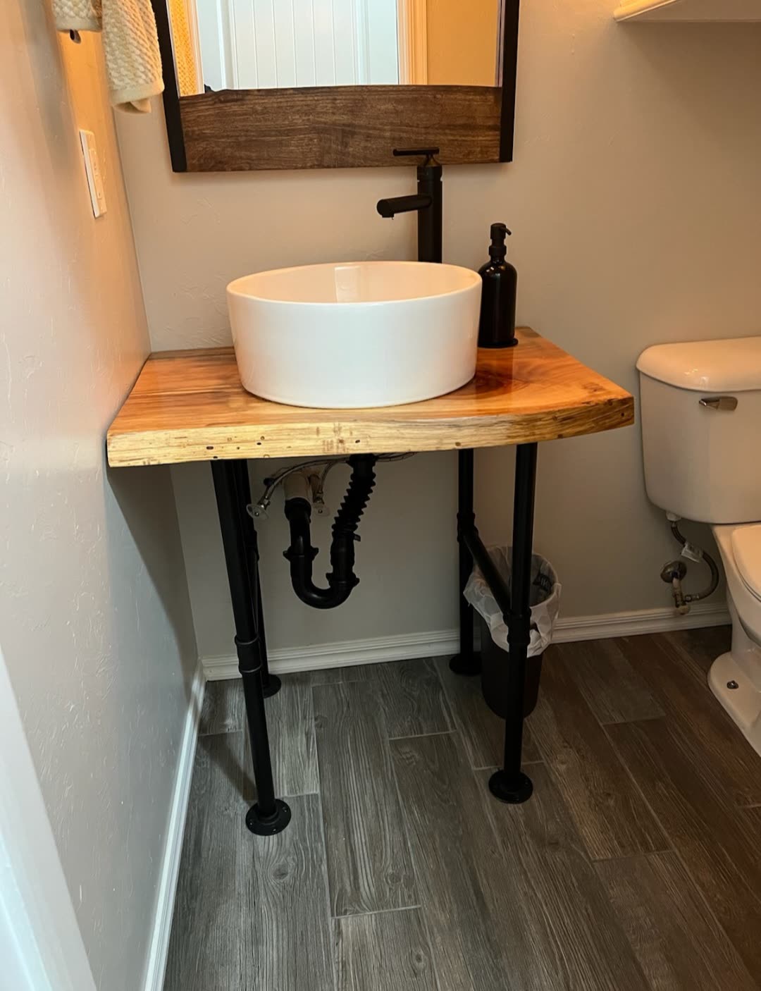 Live-edge pecan vanity top with a vessel sink