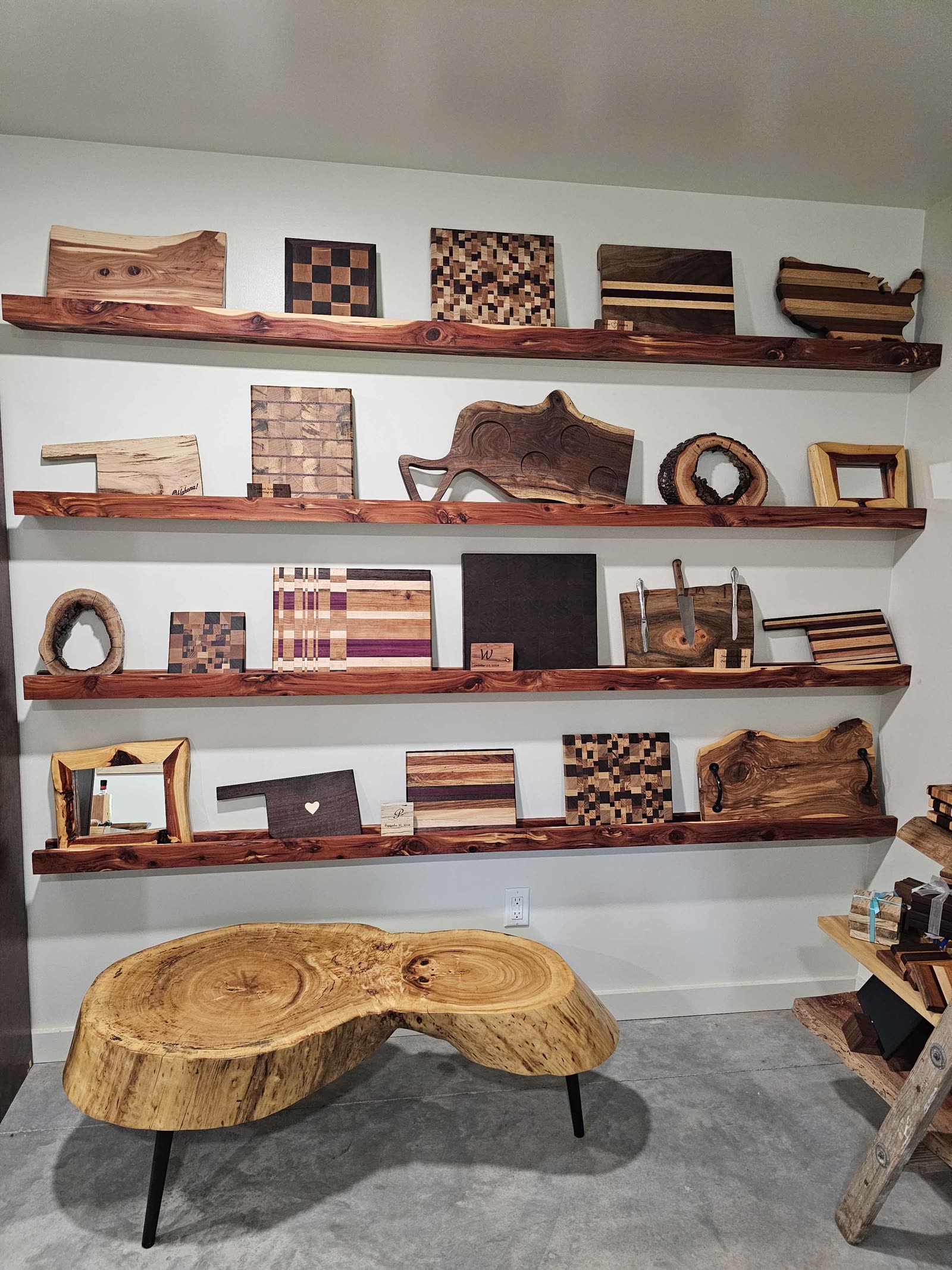 Cedar display shelves full of cutting boards