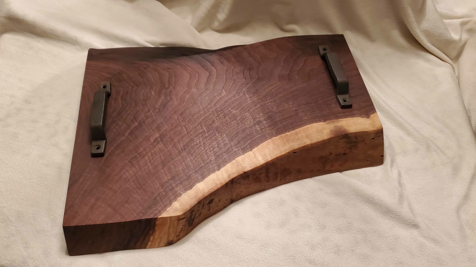 Live-edge walnut charcuterie board with handles